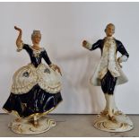A pair of Royal Dux dancing figures