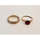 A hallmarked 9ct yellow gold single stone garnet set ring, ring size O (mis-shapen), with a