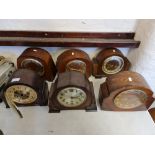 Six mantle clocks with domed tops.