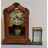 A brass Eurotime carriage clock together with pine mantle clock.