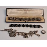A collection of silver jewellery to include, a charm bracelet with approx. 22 various charms, a link