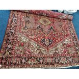 A large Afghan red and beige rug 340 cm 265 cm approx.