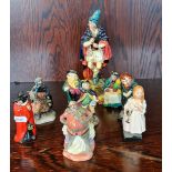 A Royal Doulton The Pied Piper together with eight small Royal Doulton figures.