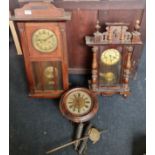 A German style round face wall clock together with two wall clocks.