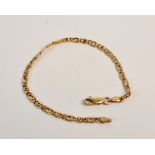 A fancy curb link bracelet, stamped 750, approx. length 19cms