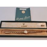 A Lady's Rolex wristwatch stamped 9ct gold on clasp, on a bracelet strap, dial having hourly
