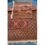 Two Afghan style brown rugs.