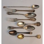 A collection of silver some hallmarked to include spoons, a stirrer spoon with gold tips, and two