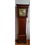 A mahogany granddaughter clock with brass face height 156,5 cm.