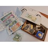 A collection of various coins and bank notes