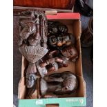 A box containing carved African figures.