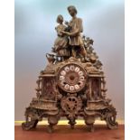 A brass French style mantle clock with Romeo and Juliet to top height 45 cm.