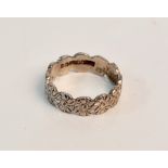 A hallmarked 18ct white gold patterned band ring, ring size M 1/2, approx. weight 5gms