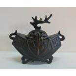 A Chinese bronze censer with tree design.