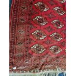 A Persian style red rug.