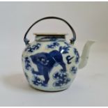 A 19th century Chinese blue and white teapot Foo dog and cloud design with metal handles height 9,