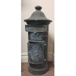 A cast iron pillar letter box painted grey height 104 cm.