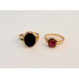 A red stone ring, ring size N½, with a black stone signet ring, stamped 15ct, ring size N.