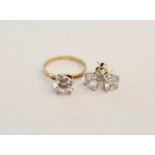 A cubic zirconia single stone ring, ring size J½, with a pair of cubic zirconia stud earrings