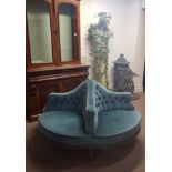 A Victorian conversation sofa with four seats turquoise upholstered on four legs