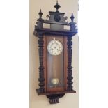 A walnut cased wall clock and a oak barometer.