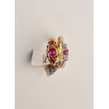 A hallmarked 18ct yellow gold three stone ruby ring, ring size P, and a hallmarked 18ct yellow