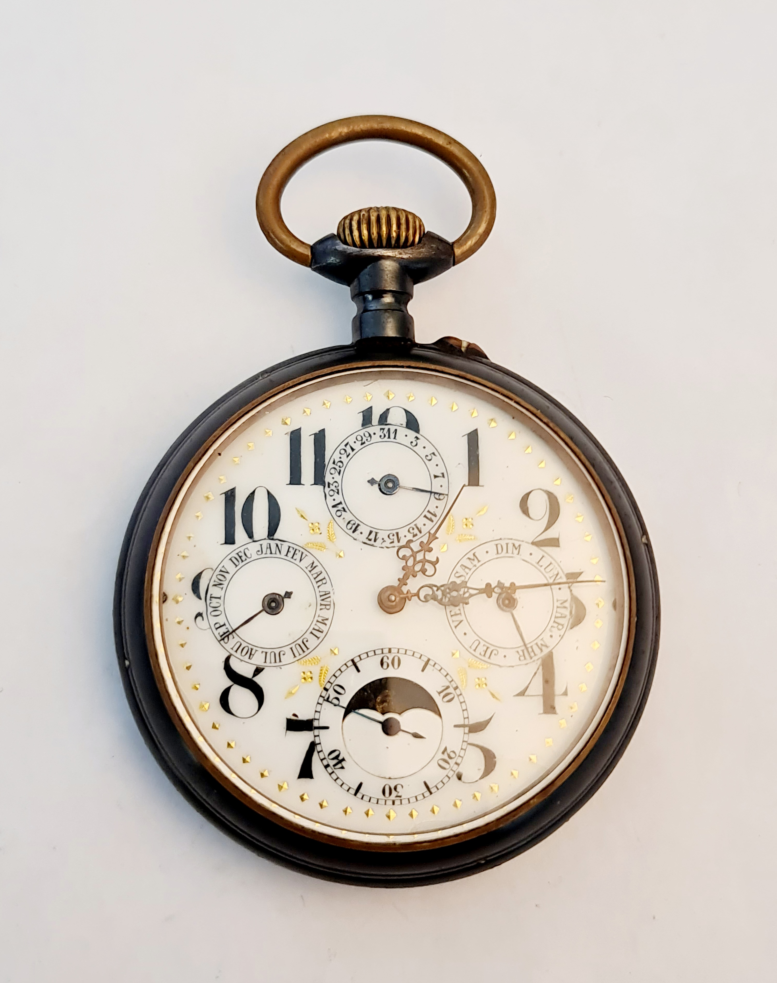 A French base metal goliath pocket watch with subsidiary dials for minutes, day, date, and month