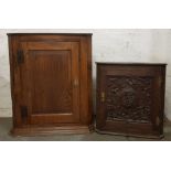 Two oak wall mounted corner cabinets.