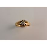 A hallmarked 18ct yellow gold diamond solitaire ring, set with an old cut diamond measuring