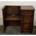 A distressed oak telephone table with seat.