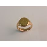 A hallmarked 9ct yellow gold engraved signet ring, ring size Q.