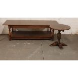 A distressed oak coffee table together with a round topped table.