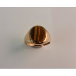 A hallmarked 9ct yellow gold tigers eye signet ring, ring size M.