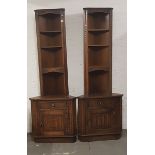 A pair of oak Jaycee corner cabinets.