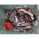 A box of car logo badges.