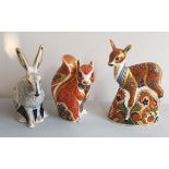 Three Royal Crown Derby figures squirrel deer and rabbit.