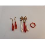 A pair of red stone dropper earrings, a hardstone band ring and a mother of pearl and red stone
