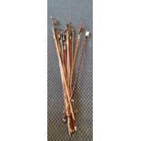 Fifteen 4/4 violin bows.