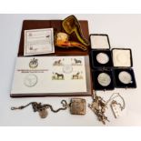 A hallmarked silver vesta case with central monogram on albert chain with t-bar, coin holder, a