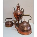 A copper samovar and two copper kettles.