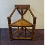 An oak carved tuner’s chair.