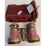 A pair of opera glasses, of pink floral design in pouch