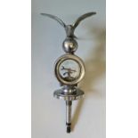 A Wilmot calorimeter chrome car mascot with a flying swallow to top 28 cm.