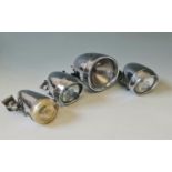 Four Joseph Lucas chrome cycle lights.