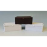 Three Joseph Lucas Bakelite cigarette boxes two white and one brown.