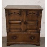A distressed oak television cabinet.