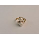 A two pearl on a twist ring, ring size D. approx. weight 3.3gms pear size approx. 5mm