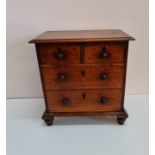 An oak small apprentice four drawer chest, height 29,5 cm.