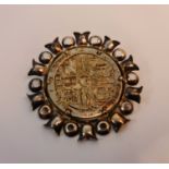 A medallion/brooch, date 1969 and markings around rim