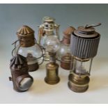 Six various oil lamps.